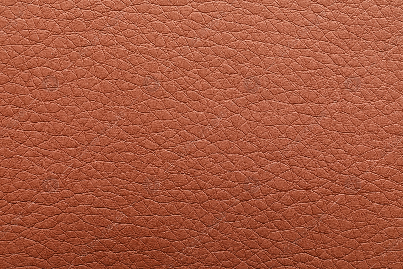 Photo of Texture of brown leather as background, closeup