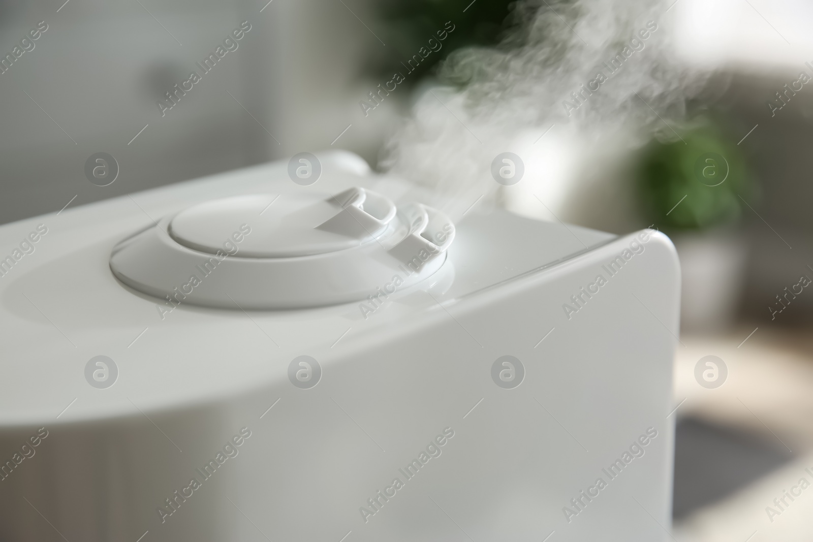 Photo of Modern air humidifier at home, closeup view