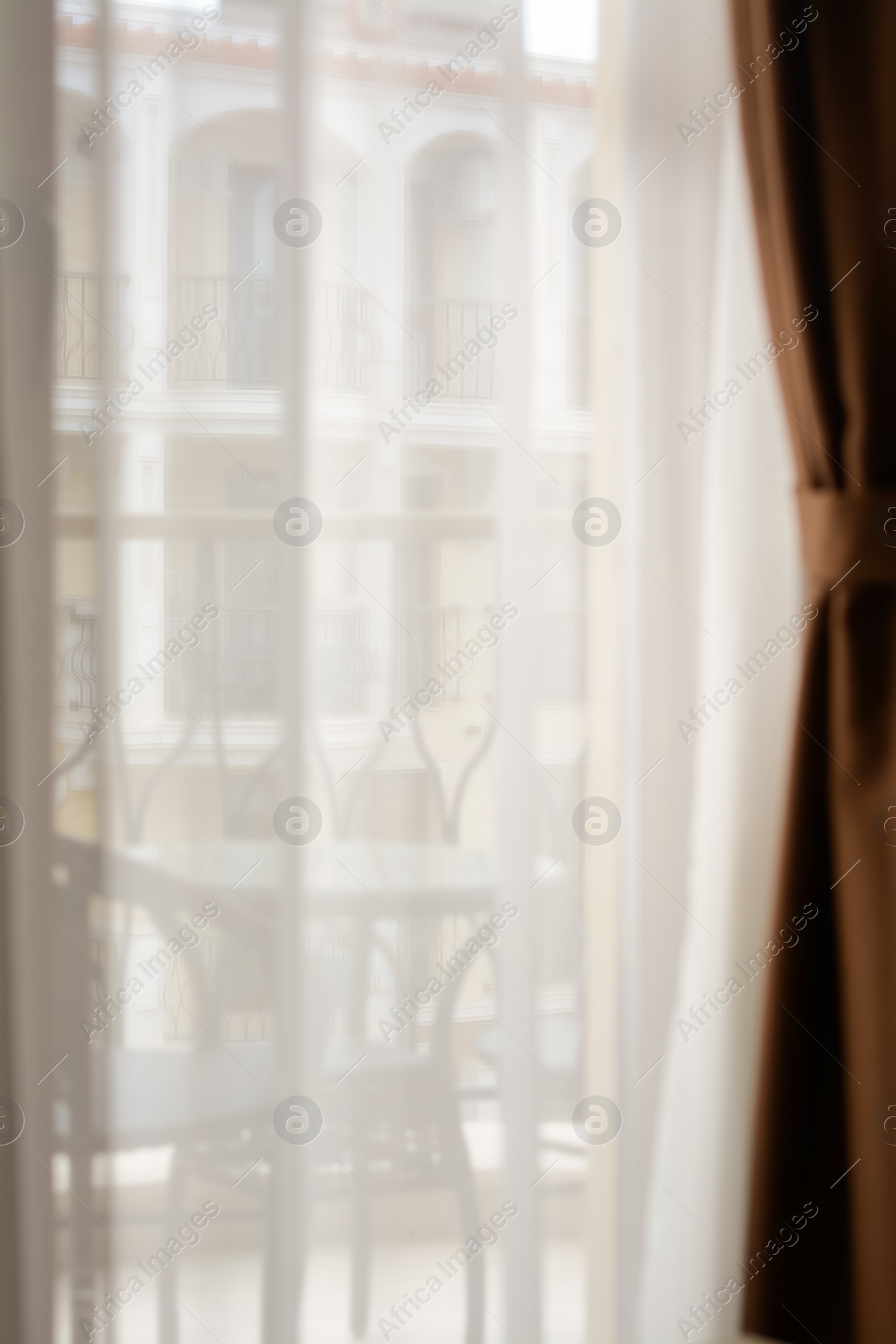 Photo of Window behind white curtain indoors in morning