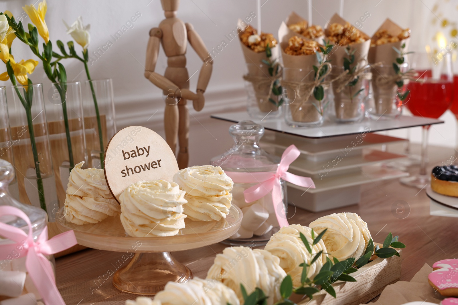 Photo of Delicious party treats on wooden table indoors