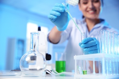 Photo of Female scientist working in chemistry laboratory, closeup