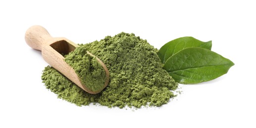 Photo of Pile of green matcha powder, scoop and leaves isolated on white