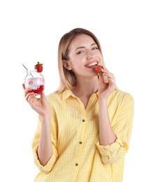 Young attractive woman eating tasty yogurt on white background