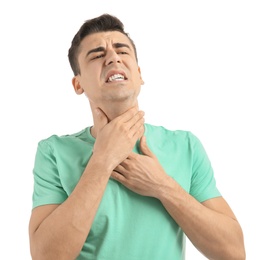Photo of Young man suffering from sore throat on white background