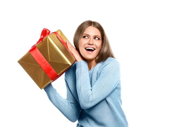 Photo of Emotional young woman with Christmas gift on white background