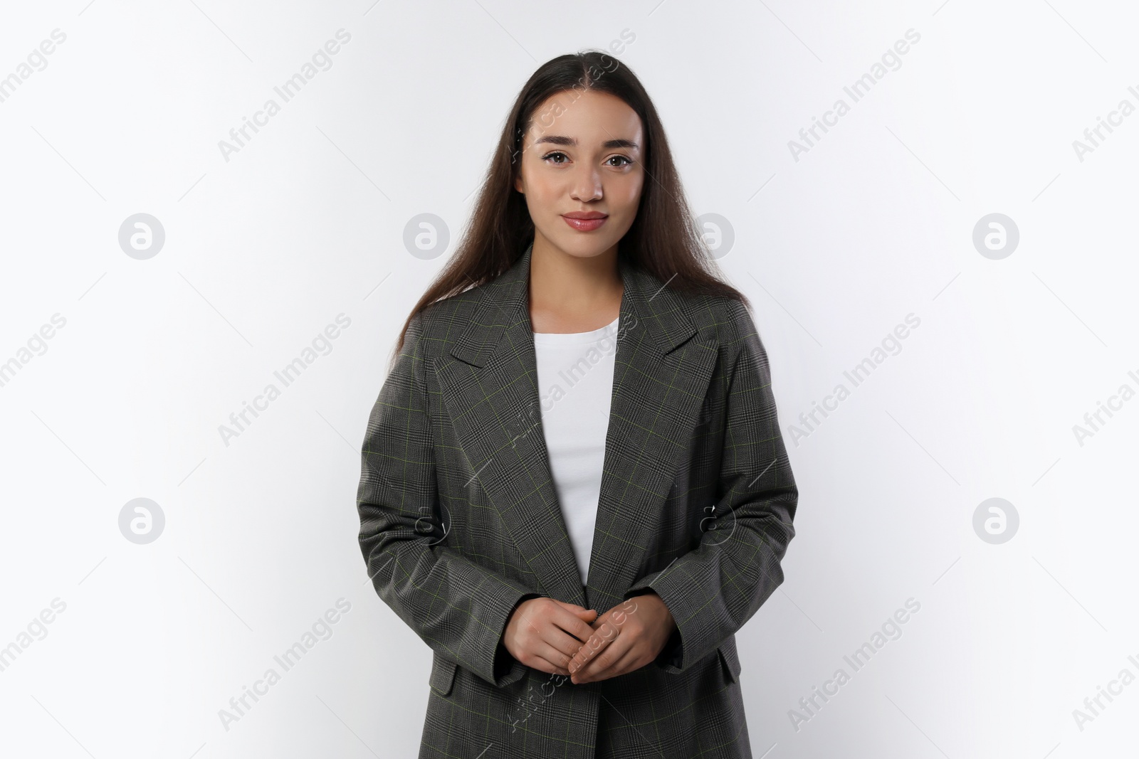 Photo of Portrait of beautiful young woman in stylish jacket on white background