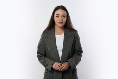 Photo of Portrait of beautiful young woman in stylish jacket on white background