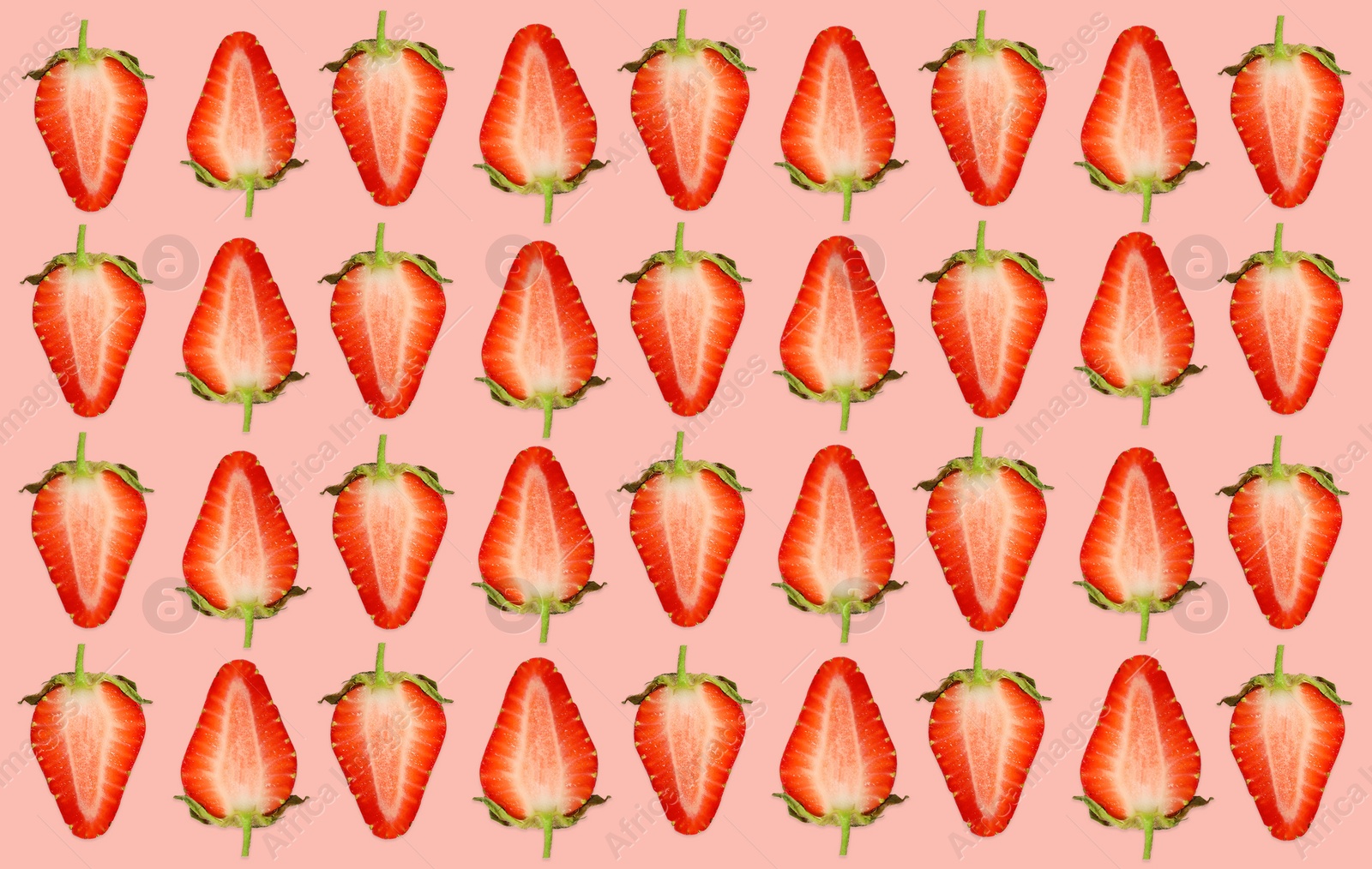 Image of Pattern of strawberry halves on pale pink background