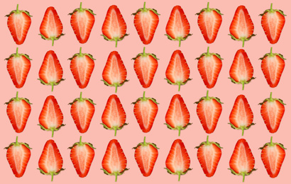 Pattern of strawberry halves on pale pink background