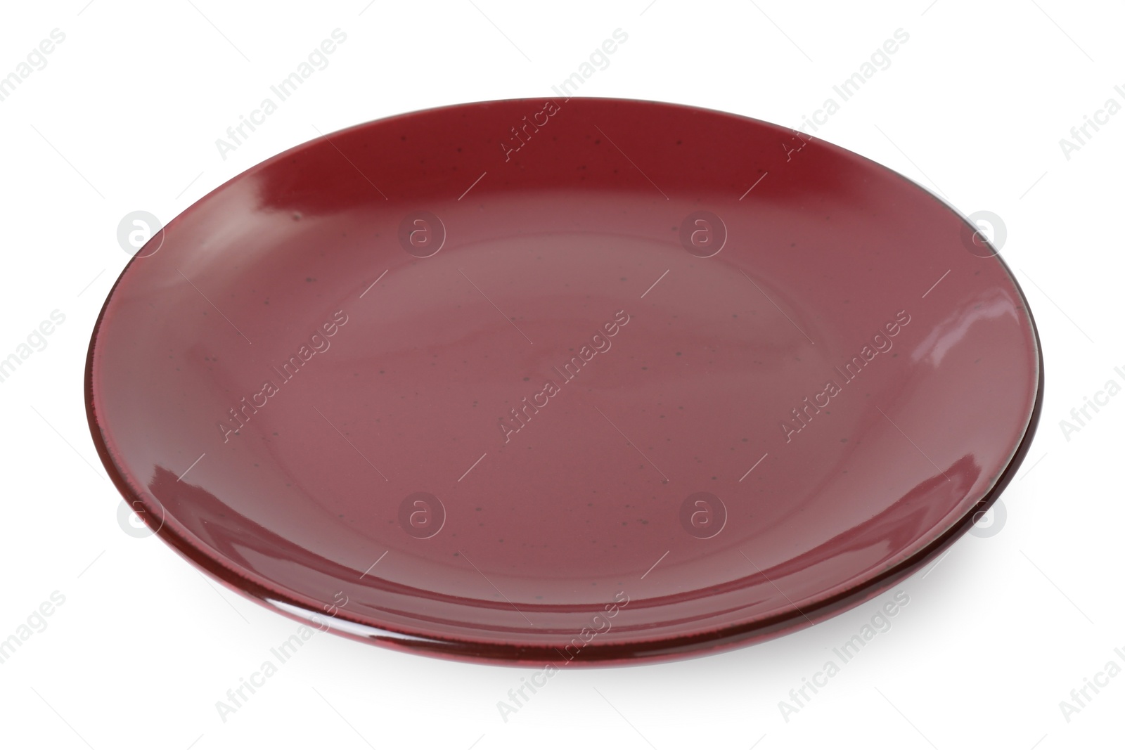 Photo of One burgundy ceramic plate isolated on white