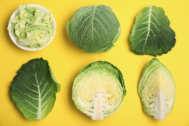 Photo of Flat lay composition with savoy cabbages on color background