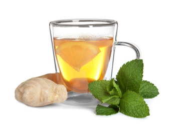 Photo of Glass cup with hot ginger tea, mint and lemon on white background