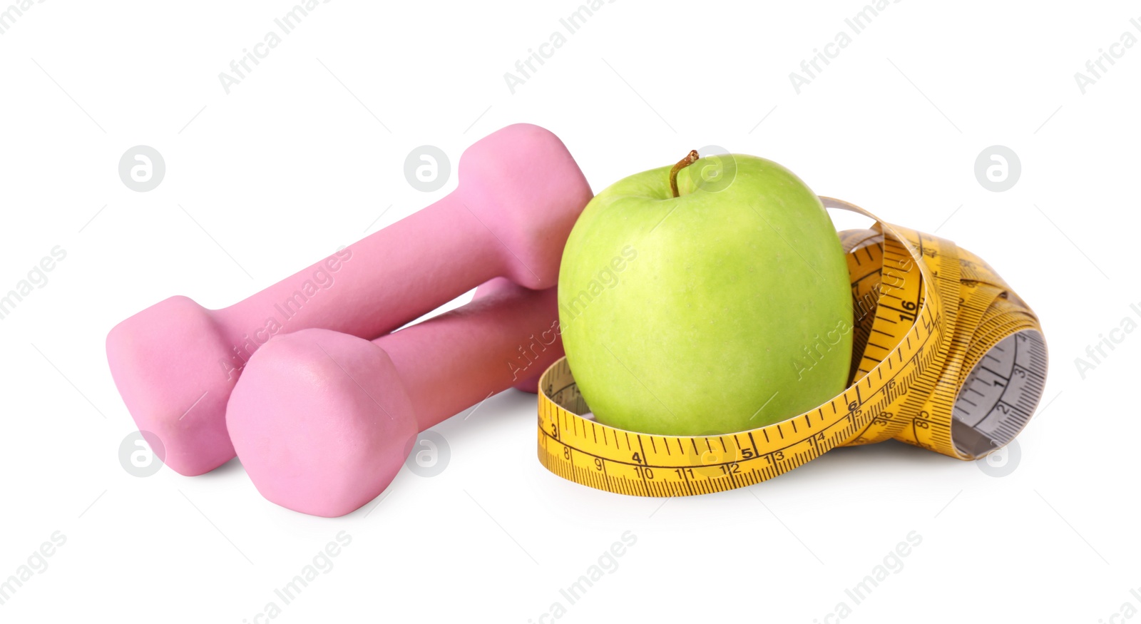 Photo of Dumbbells, apple and measuring tape isolated on white