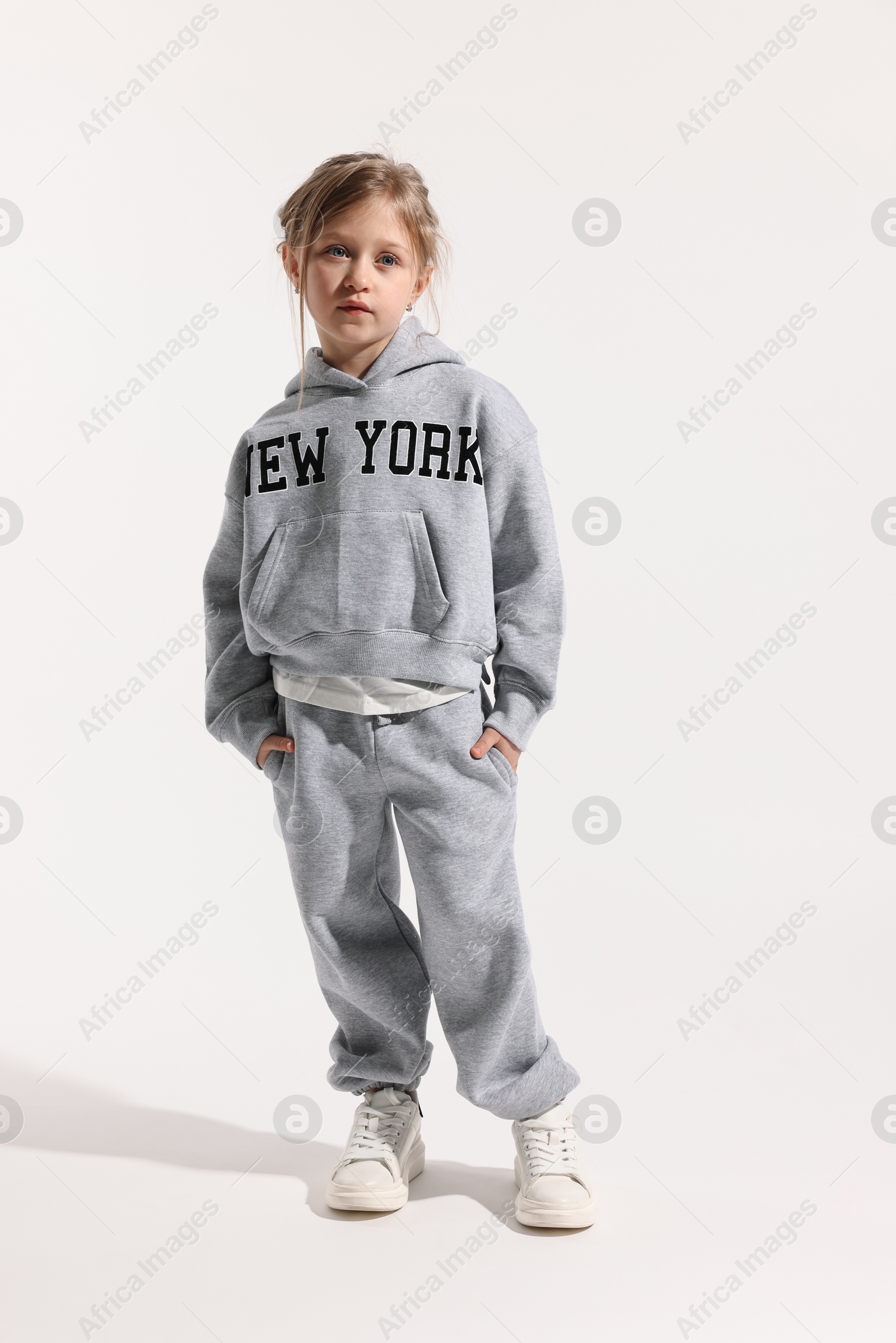 Photo of Fashion concept. Stylish girl posing on white background