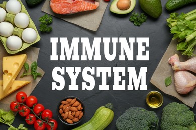 Image of Immune system boosting with proper nutrition. Different foods on black table, flat lay