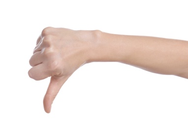 Photo of Woman showing thumb down gesture on white background, closeup of hand