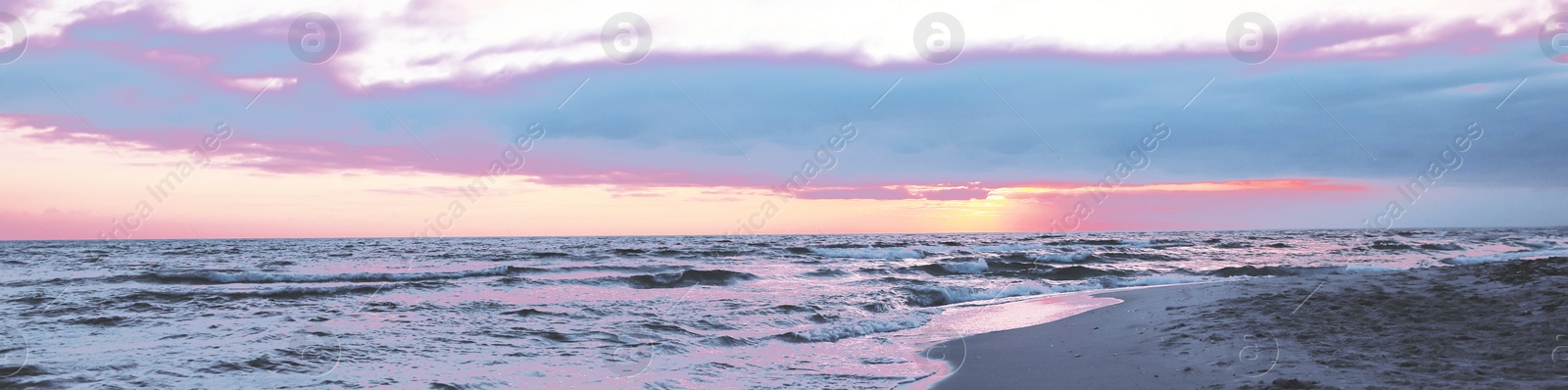 Image of Beautiful panorama of cloudy sky over sea at sunset. Banner design