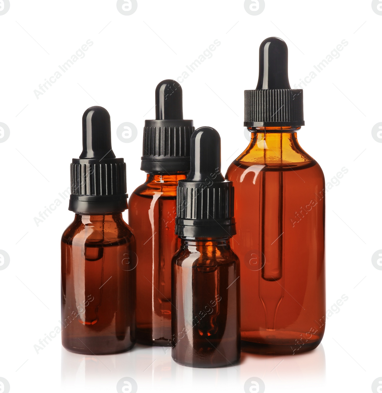 Photo of Cosmetic bottles of essential oils on white background