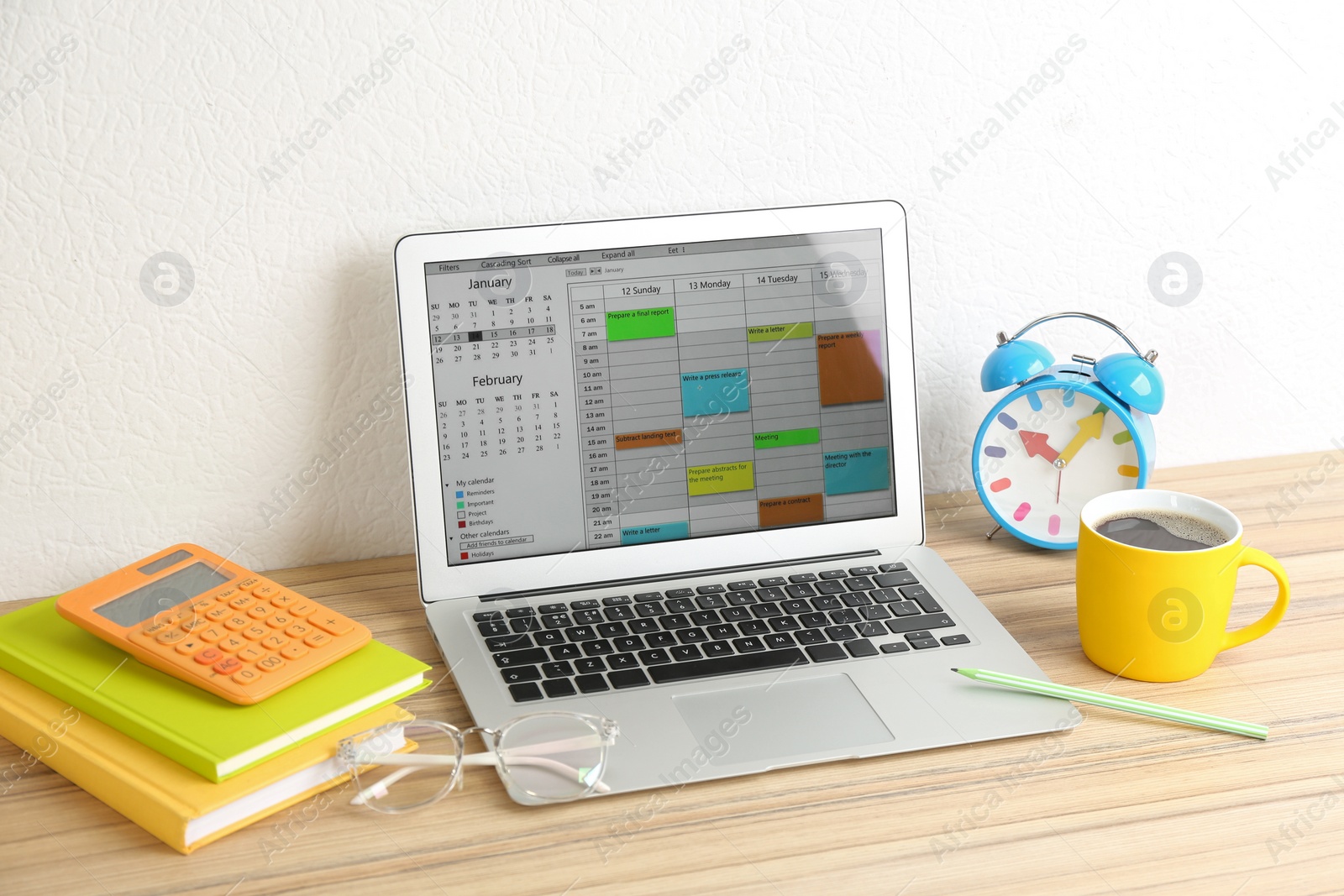 Photo of Modern laptop with calendar app in office