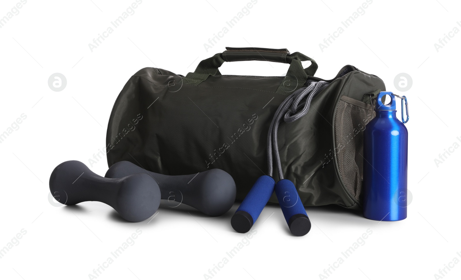 Photo of Sports bag and gym equipment on white background