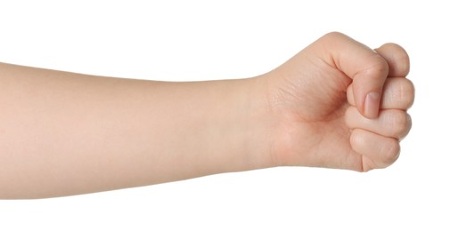 Playing rock, paper and scissors. Woman showing fist on white background, closeup