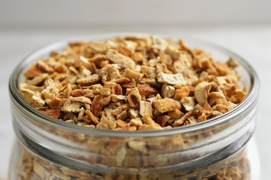 Photo of Jar of dried orange zest seasoning, closeup