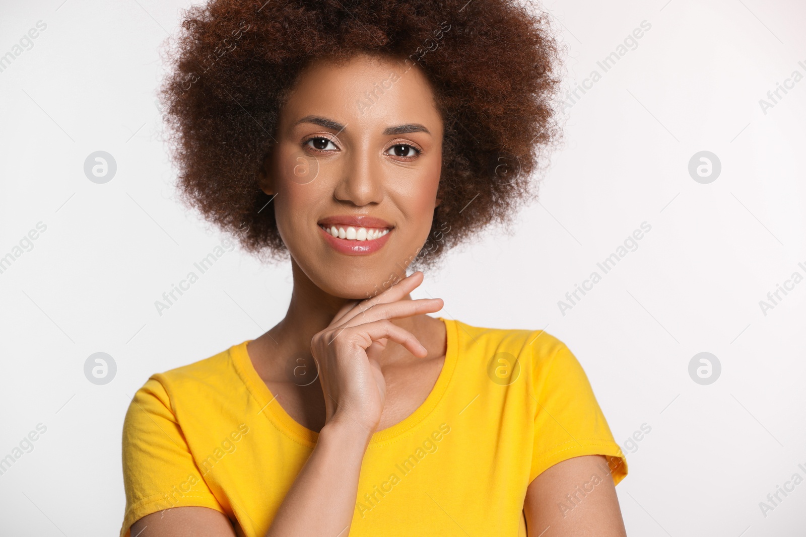 Photo of Portrait of beautiful young woman with glamorous makeup on white background