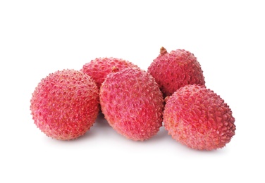 Pile of fresh ripe lychees on white background