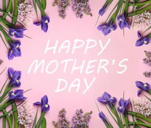 Image of Frame made with beautiful spring flowers and phrase HAPPY MOTHER'S DAY on light pink background, flat lay