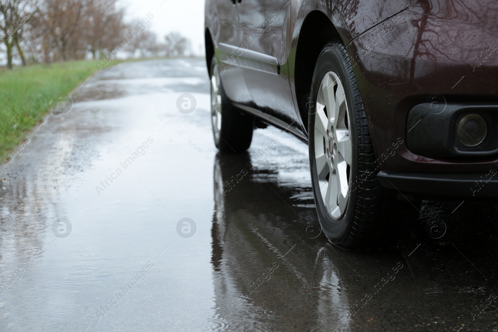 Photo of Car parked outdoors on rainy day, closeup