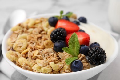 Photo of Tasty oatmeal and fresh berries in bowl, closeup. Healthy breakfast