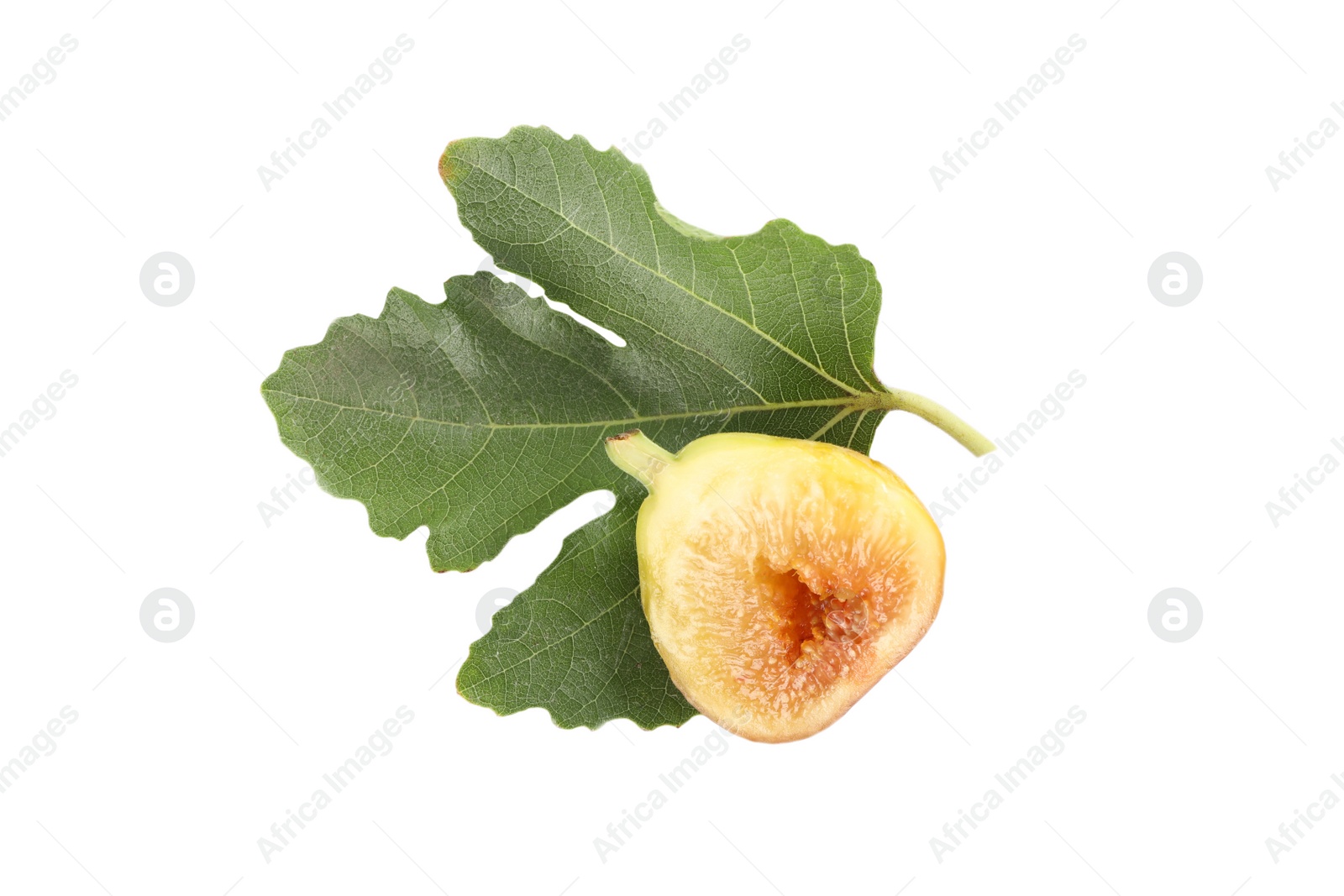 Photo of Half of tasty green fig with leaf isolated on white, top view