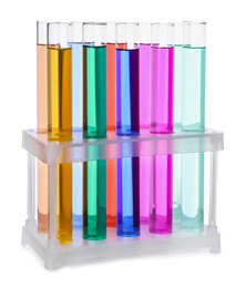 Many test tubes with colorful liquids in stand on white background