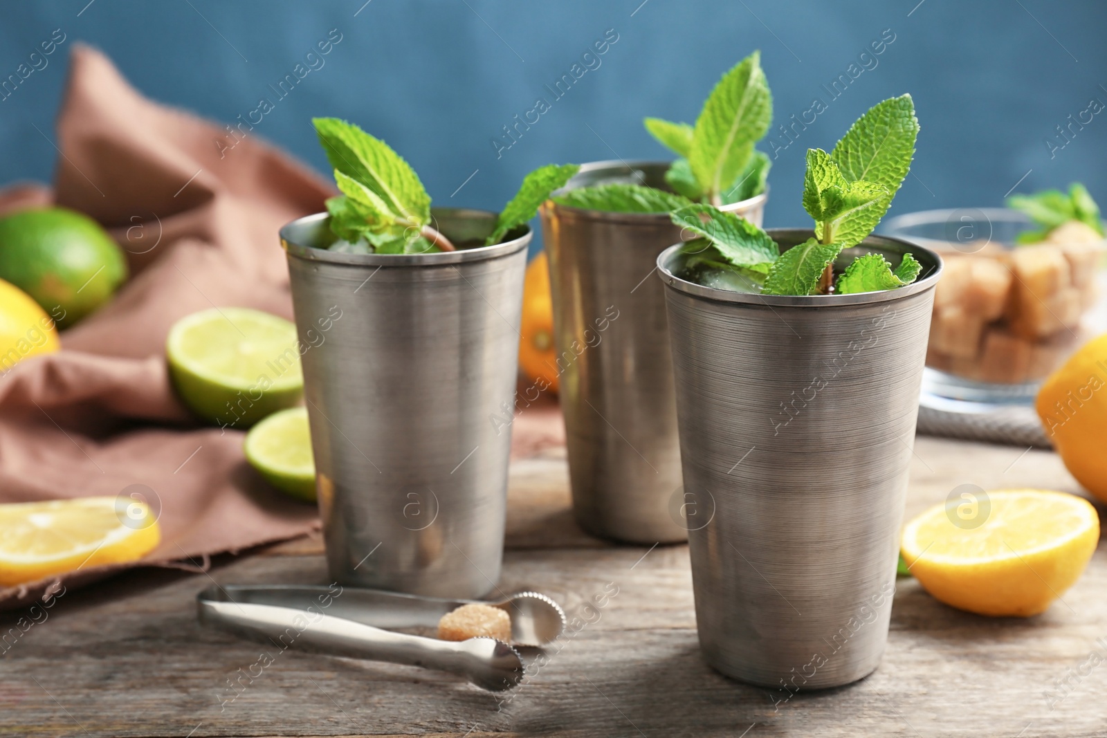 Photo of Composition with delicious mint julep cocktail on table