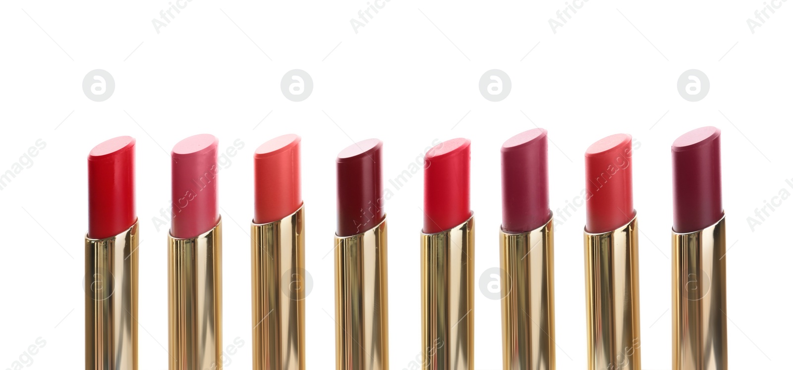 Photo of Many different stylish lipsticks on white background