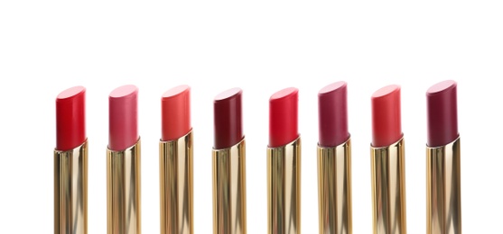 Photo of Many different stylish lipsticks on white background