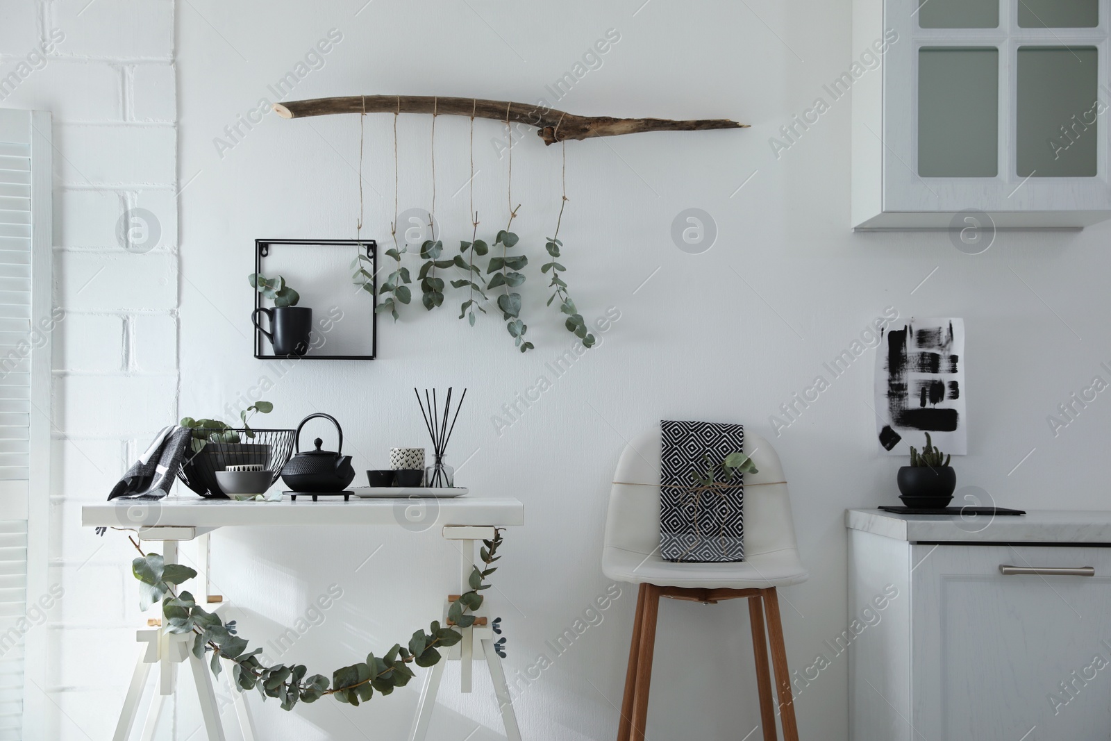 Photo of Stylish room decorated with beautiful green eucalyptus branches