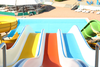 View from colorful slide in water park on sunny day