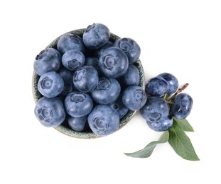 Fresh ripe blueberries and leaves isolated on white, top view