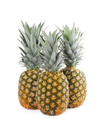 Photo of Three delicious ripe pineapples on white background