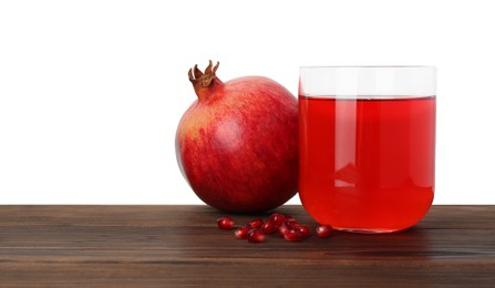 Photo of Refreshing pomegranate juice in glass, leaves and seeds on wooden table against white background. Space for text
