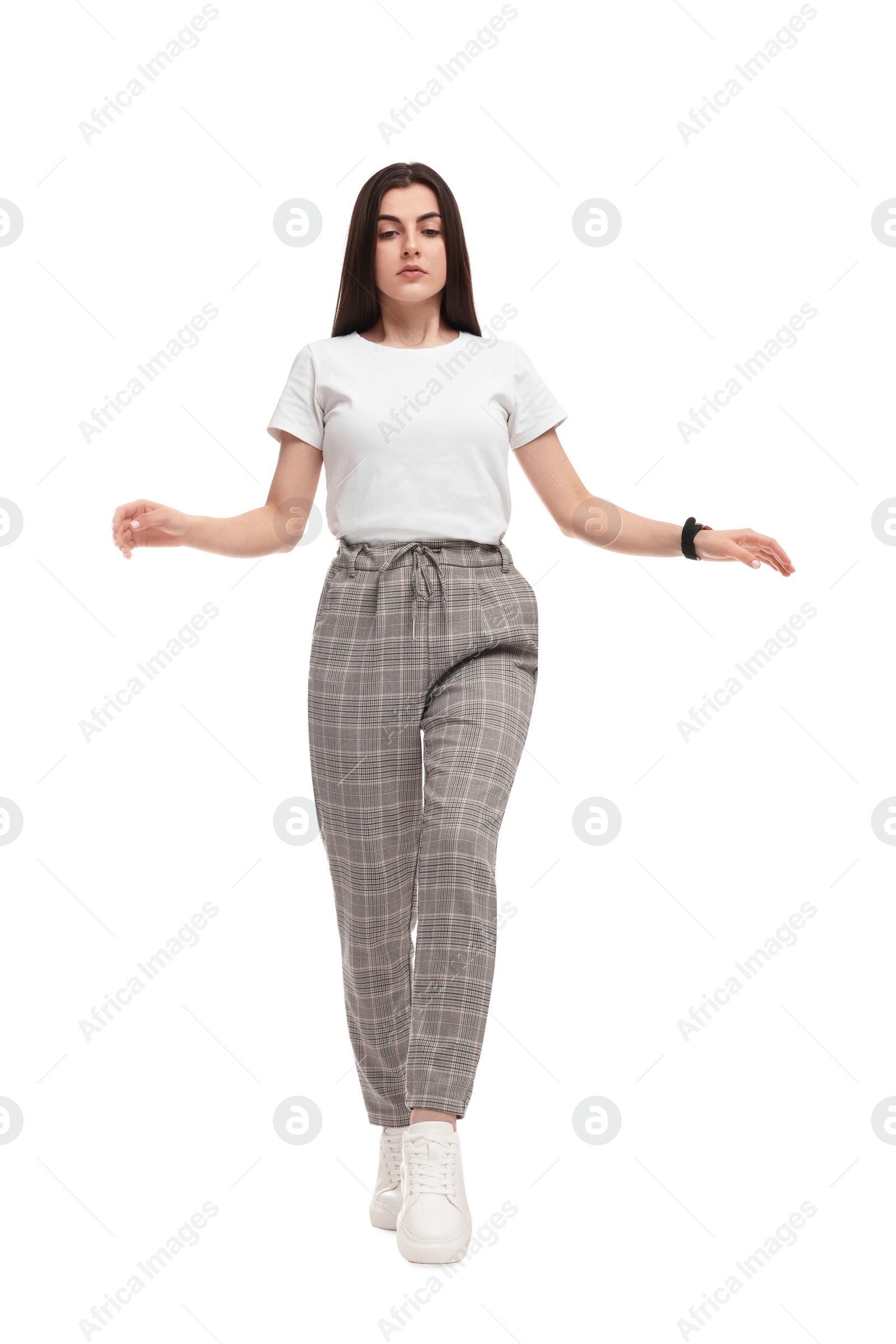 Photo of Beautiful young businesswoman in suit on white background