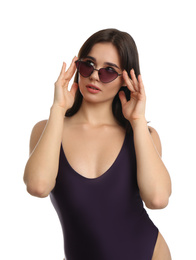 Photo of Beautiful young woman wearing swimsuit and sunglasses on white background
