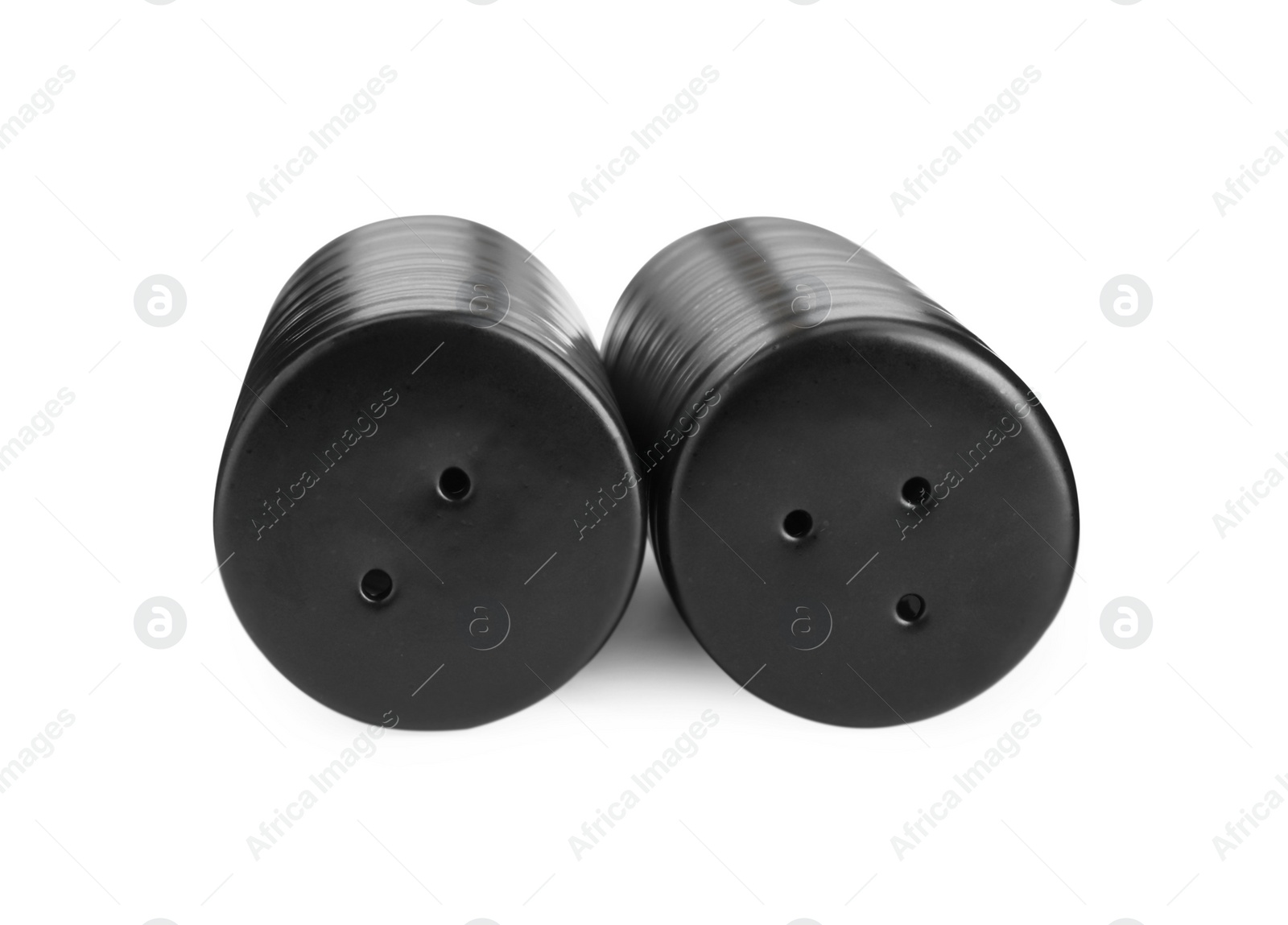 Photo of Black salt and pepper shakers isolated on white