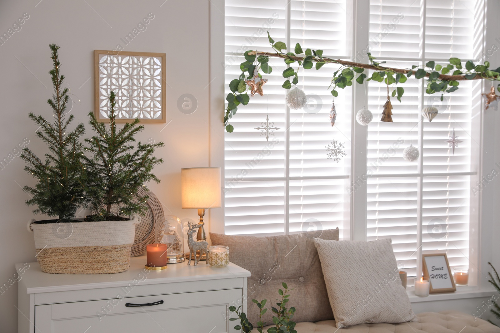 Photo of Beautiful room interior decorated for Christmas with potted firs