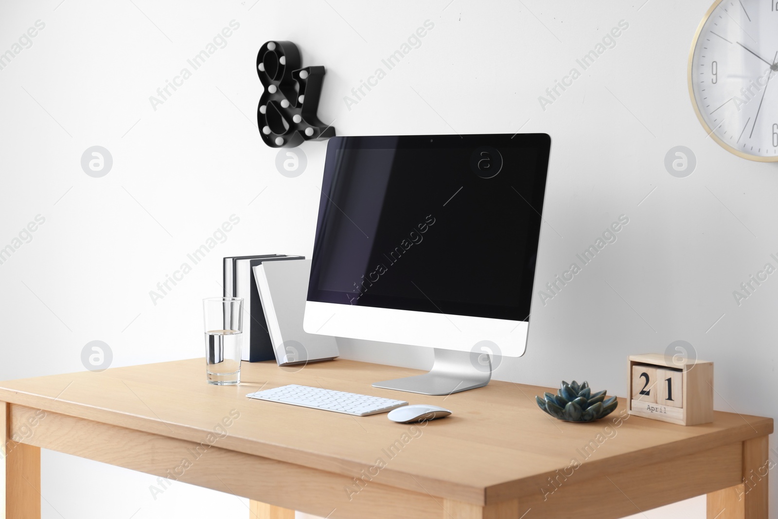 Photo of Comfortable workplace with computer on desk in home office