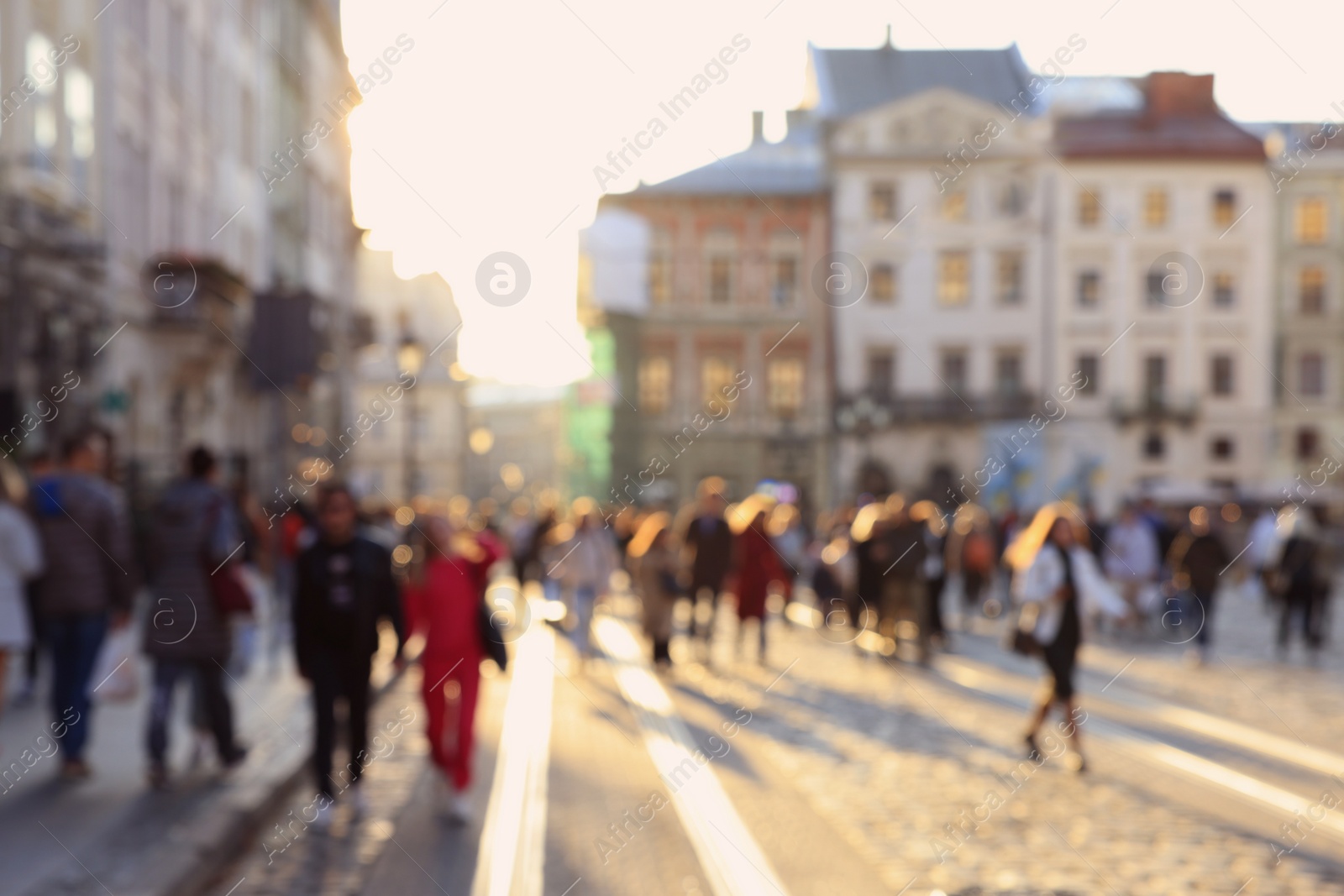 Photo of Blurred view of people walking on city street