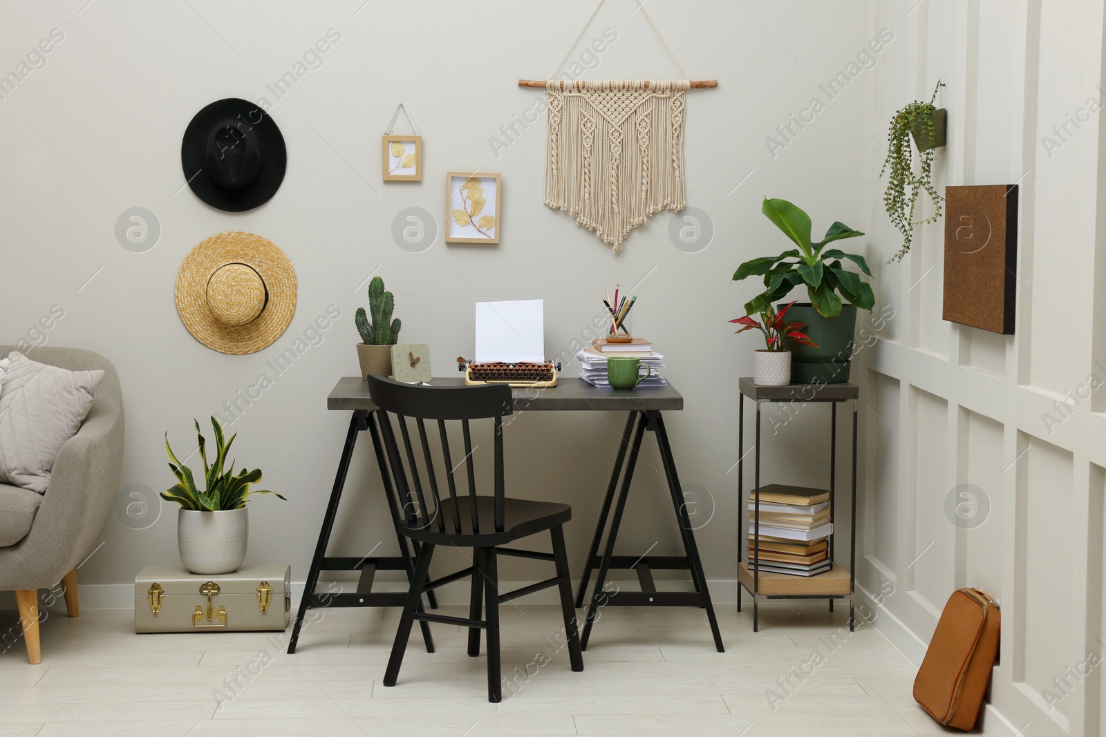 Photo of Writer's workplace with typewriter on dark table desk in room