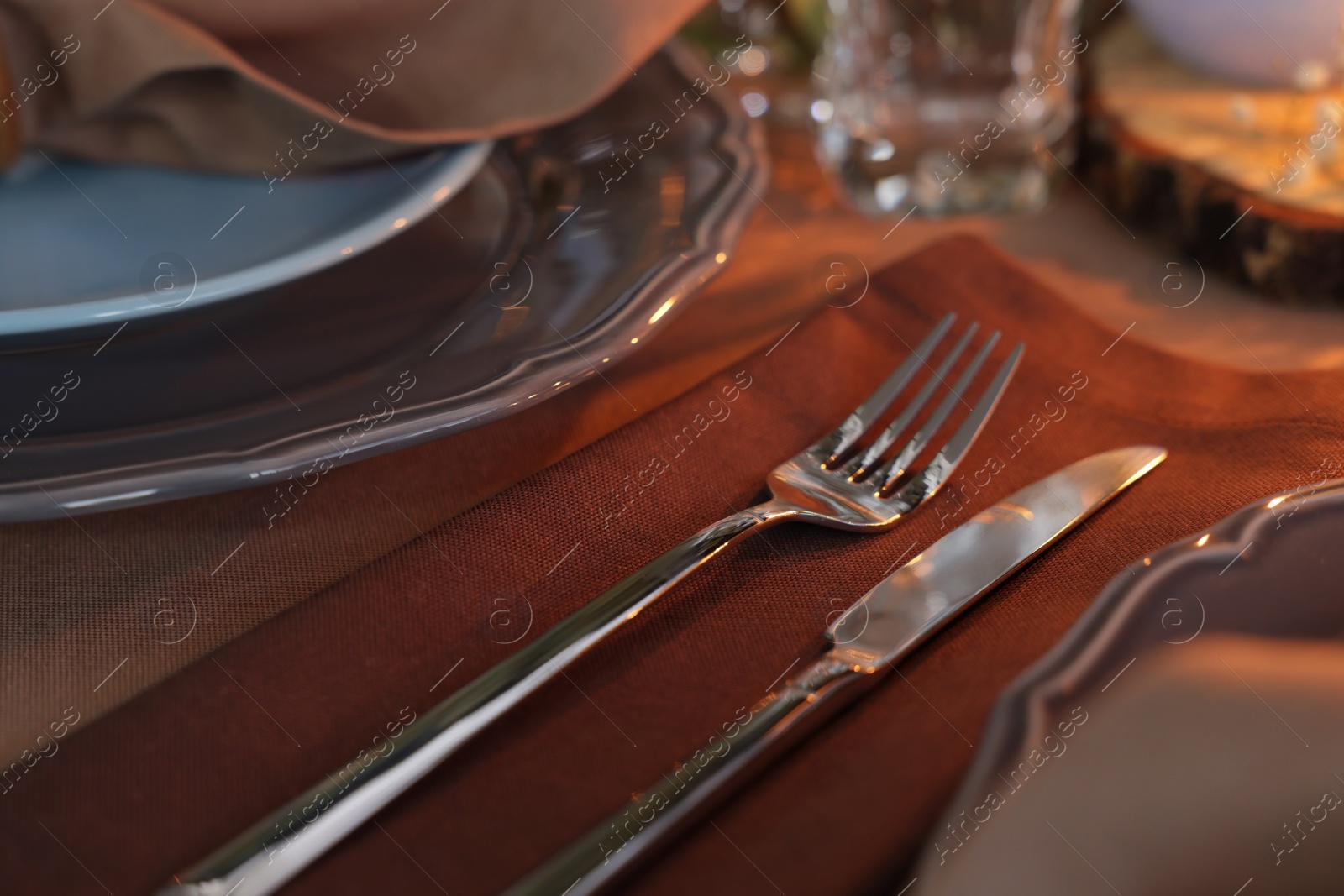 Photo of Beautiful setting with cutlery and plates on table