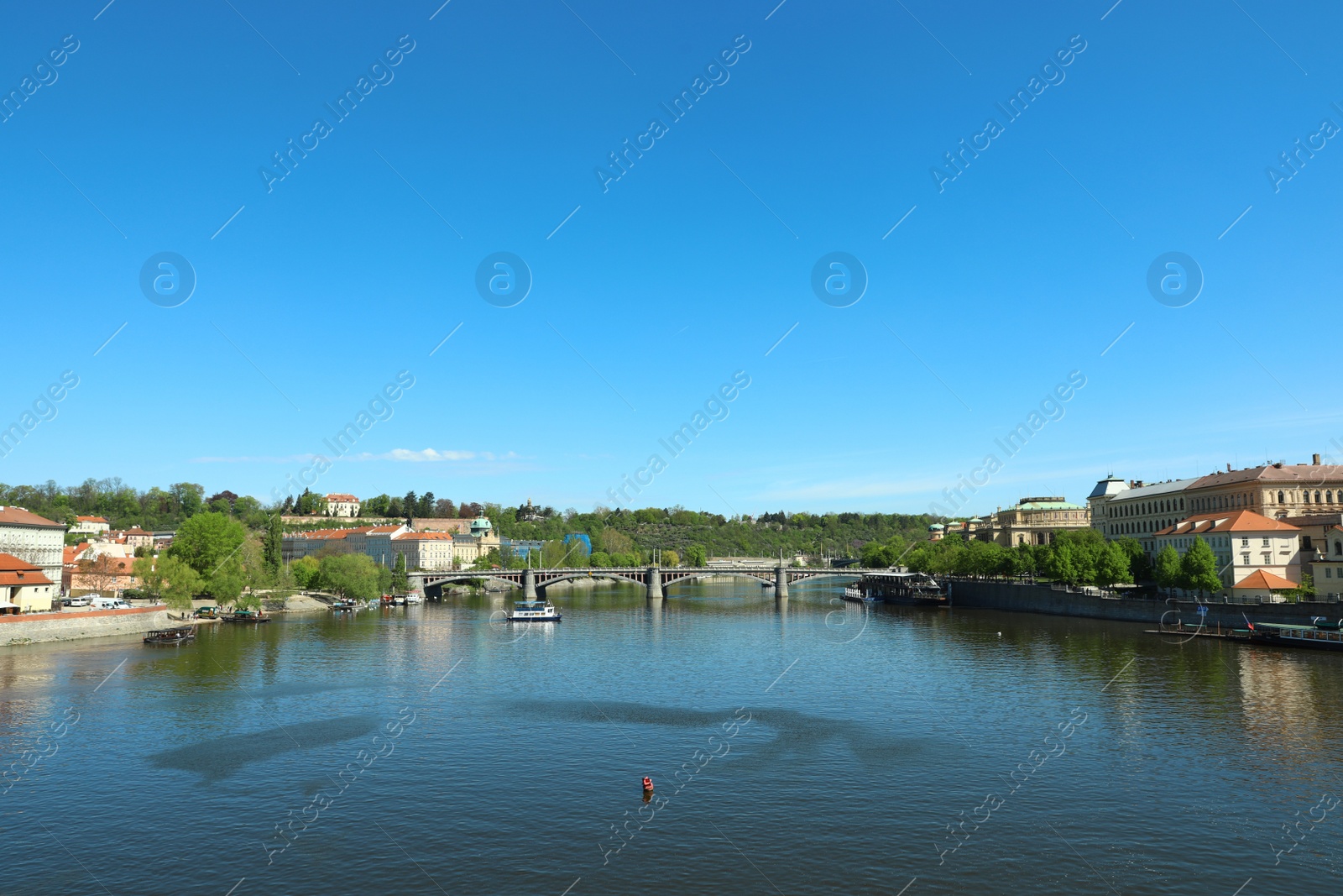 Photo of PRAGUE, CZECH REPUBLIC - APRIL 25, 2019: Cityscape with tourist attractions, Manes Bridge and Vltava river